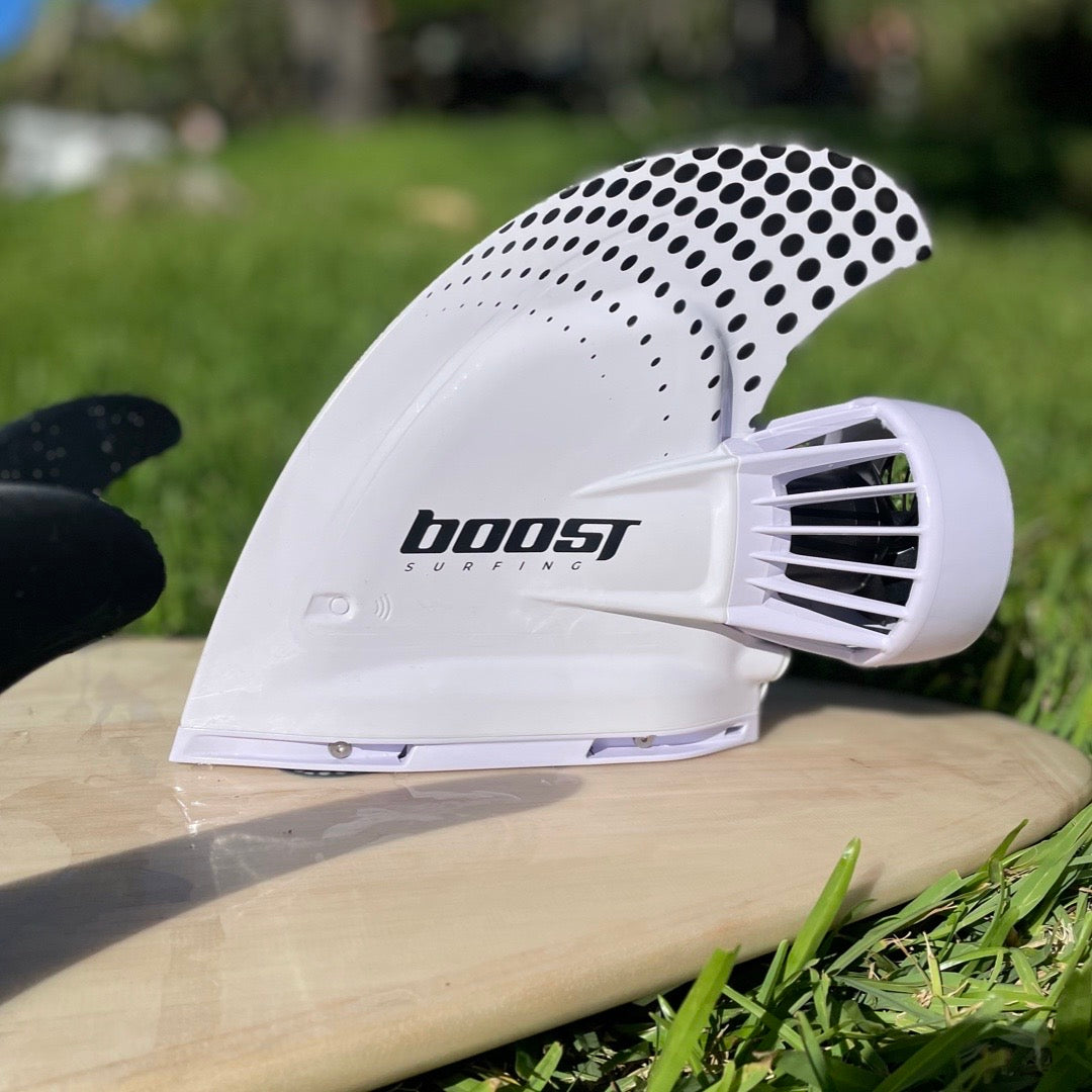 Boost Surfing Fin on a wooden surfboard